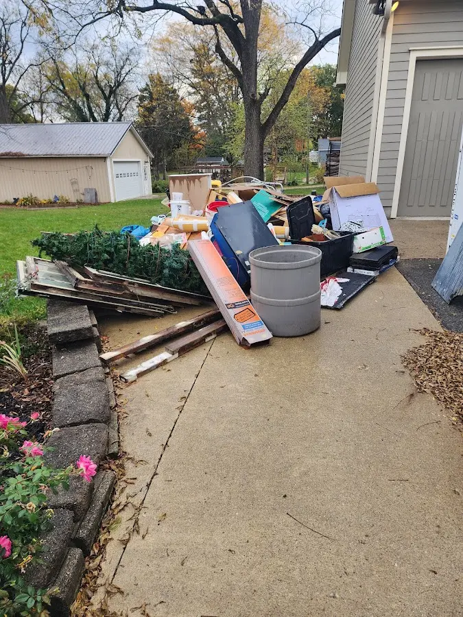 Dumpster being loaded with debris for 12 Yard Dumpster Rental in Alta Sierra